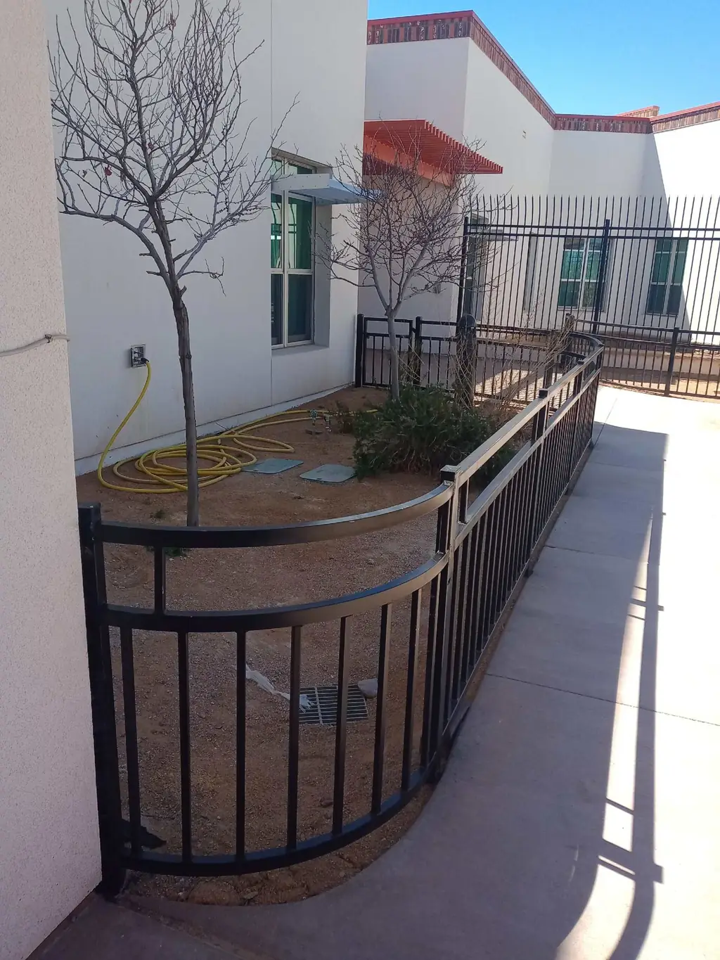 Black ornamental aluminum fence and gate on a multifamily property in Albuquerque